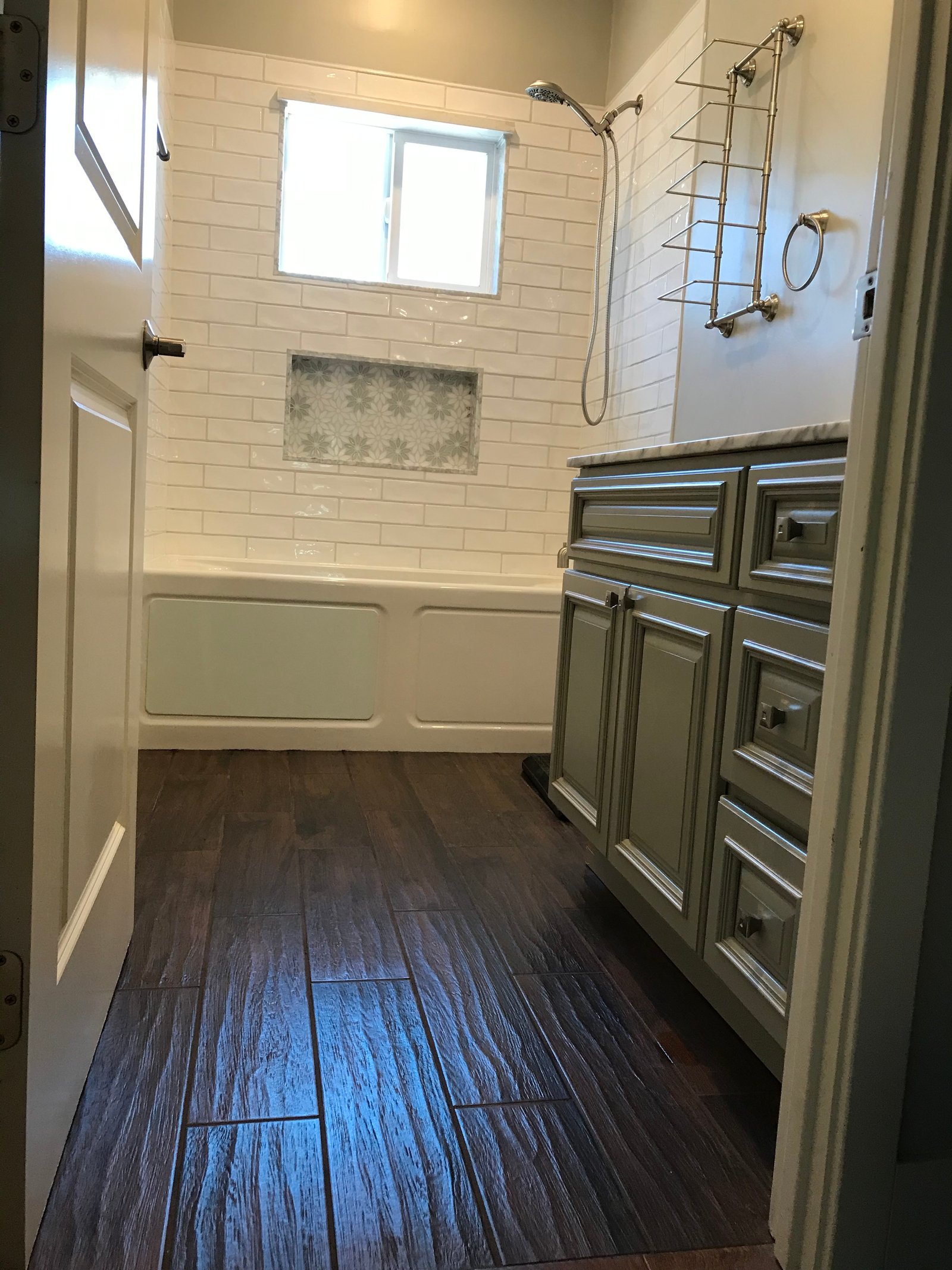 Installer setting the new toilet on its flange